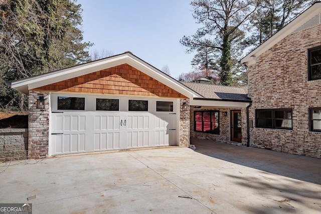 garage with concrete driveway