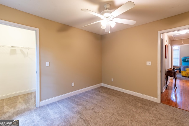2208 Clarendon Ct NE, Conyers, GA 30012 - unfurnished bedroom featuring attic access, carpet, baseboards, and a closet