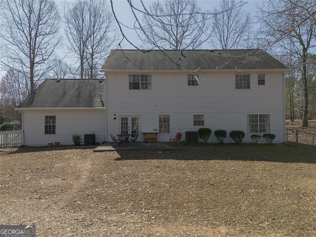 back of house with a patio, fence, french doors, cooling unit, and roof with shingles