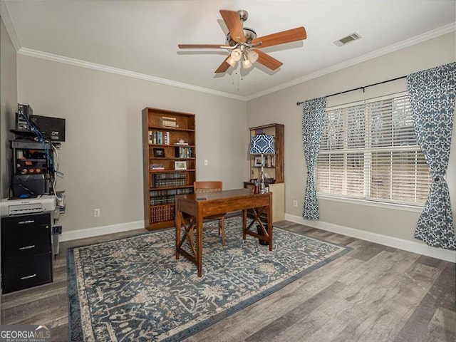 office space with visible vents, wood finished floors, ceiling fan, and ornamental molding