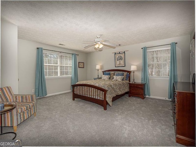 bedroom with baseboards, carpet, ceiling fan, and a textured ceiling