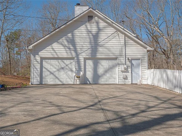 detached garage with fence