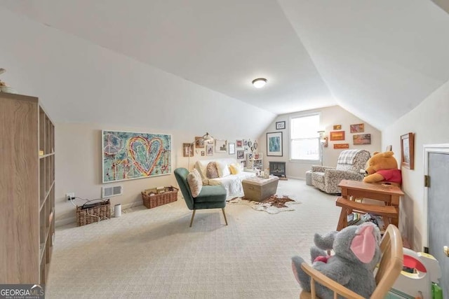 carpeted living room featuring visible vents and lofted ceiling