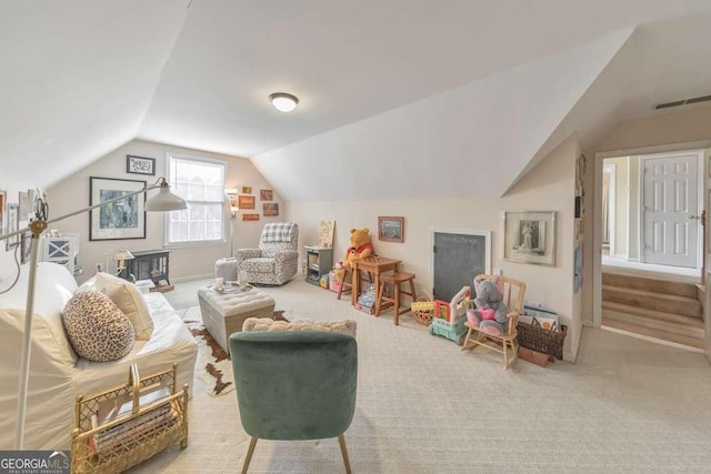 game room featuring visible vents, carpet, and vaulted ceiling