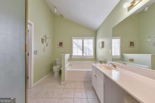 full bath with vanity, tile patterned flooring, vaulted ceiling, a garden tub, and toilet