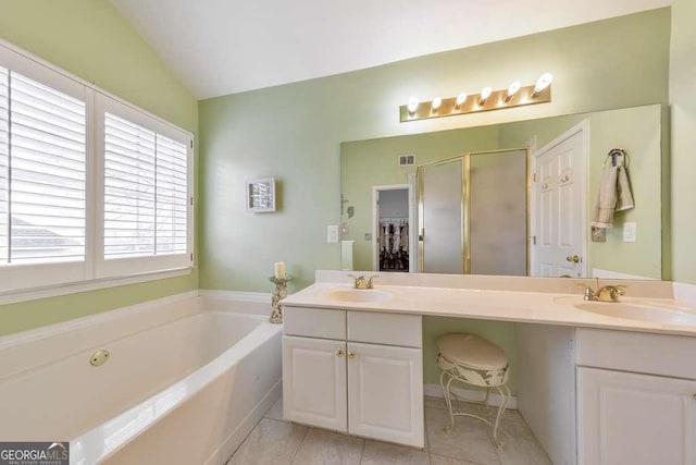 full bathroom featuring a bath, a stall shower, double vanity, and a sink