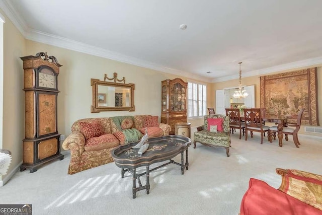 living room featuring crown molding, a notable chandelier, light colored carpet, and baseboards