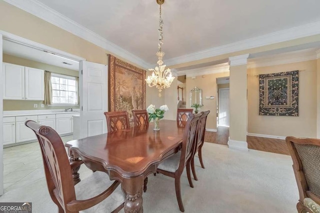 dining room with a notable chandelier and ornamental molding