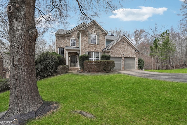 traditional-style home featuring brick siding, an attached garage, concrete driveway, and a front lawn