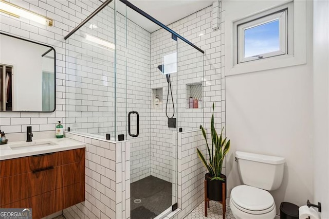 full bath featuring backsplash, a shower stall, tile walls, toilet, and vanity