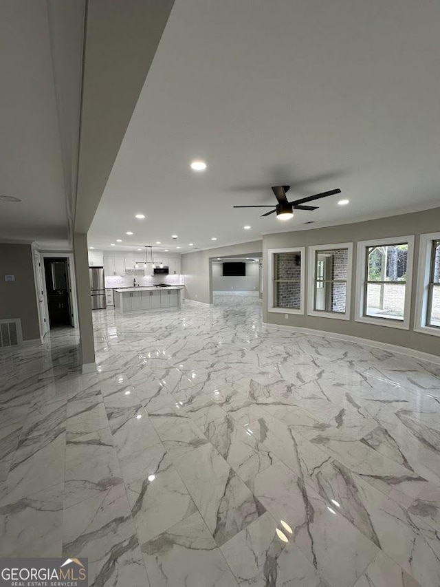 unfurnished living room featuring ornamental molding, recessed lighting, visible vents, and ceiling fan