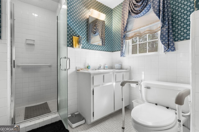 full bath with a stall shower, wallpapered walls, tile walls, wainscoting, and tile patterned flooring