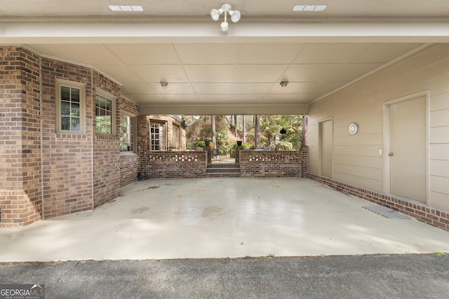 view of patio featuring an attached carport