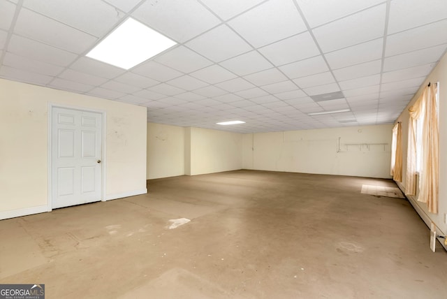 basement featuring a drop ceiling