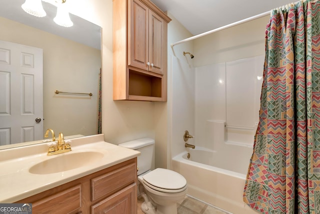 bathroom with vanity, toilet, and shower / tub combo