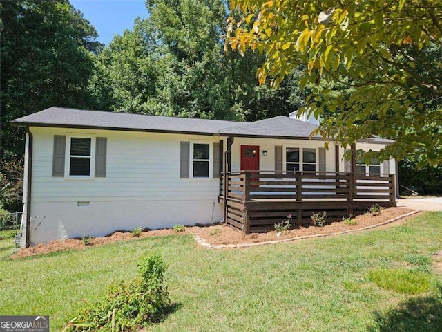 ranch-style house with crawl space, a front yard, and roof with shingles