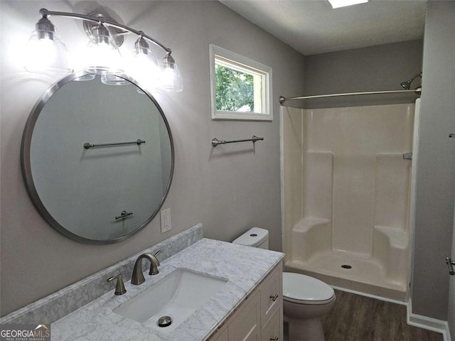 147 Mildred Ct, Dallas, GA 30157 - bathroom with wood finished floors, vanity, and a shower