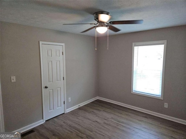 147 Mildred Ct, Dallas, GA 30157 - empty room featuring ceiling fan and dark wood-type flooring