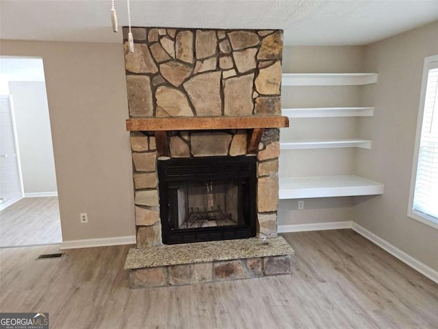 147 Mildred Ct, Dallas, GA 30157 - detailed view of wood finished floors and a fireplace