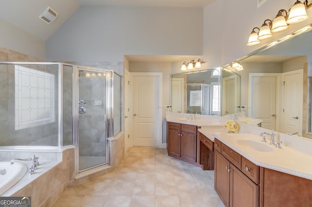 full bathroom featuring vanity, visible vents, a stall shower, tile patterned flooring, and a garden tub