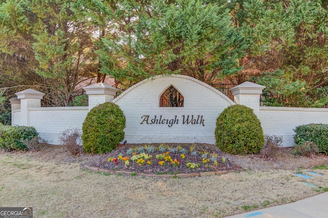 community sign featuring fence