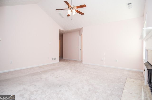 unfurnished living room with visible vents, light colored carpet, and a ceiling fan