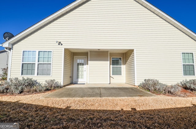 back of property featuring a patio area