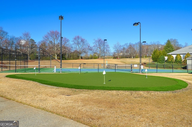 view of community with fence