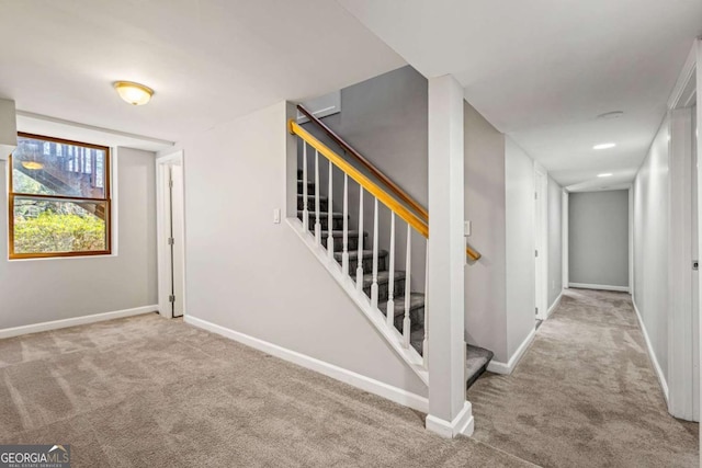 staircase with carpet and baseboards