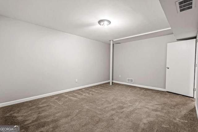 unfurnished room featuring visible vents, baseboards, and carpet flooring