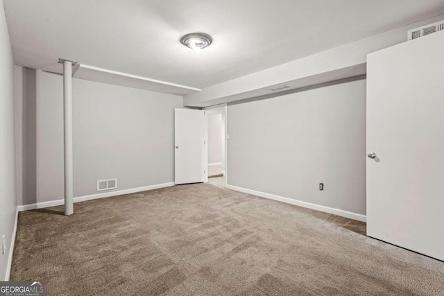 interior space featuring carpet, visible vents, and baseboards