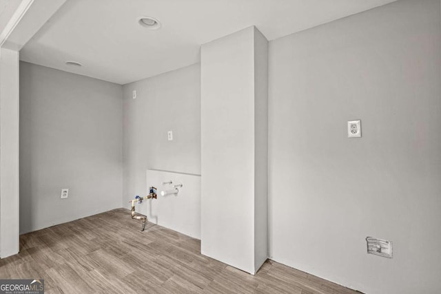 laundry room featuring wood finished floors