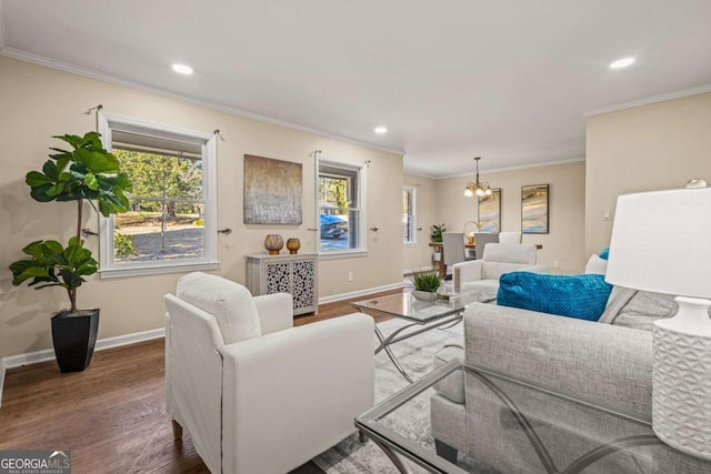 living room with crown molding, baseboards, recessed lighting, an inviting chandelier, and wood finished floors