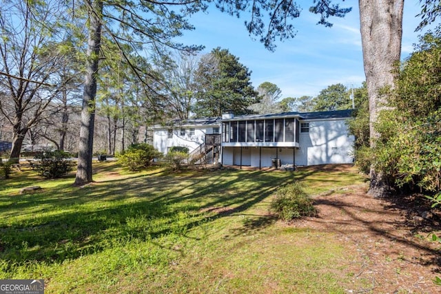 view of yard featuring a sunroom