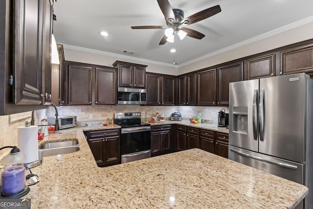 kitchen featuring decorative backsplash, dark brown cabinets, visible vents, and appliances with stainless steel finishes