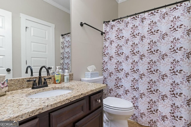 full bathroom featuring vanity, toilet, and crown molding