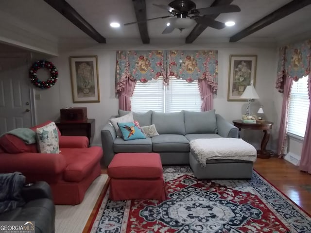 living room with wood finished floors, beamed ceiling, recessed lighting, and a ceiling fan