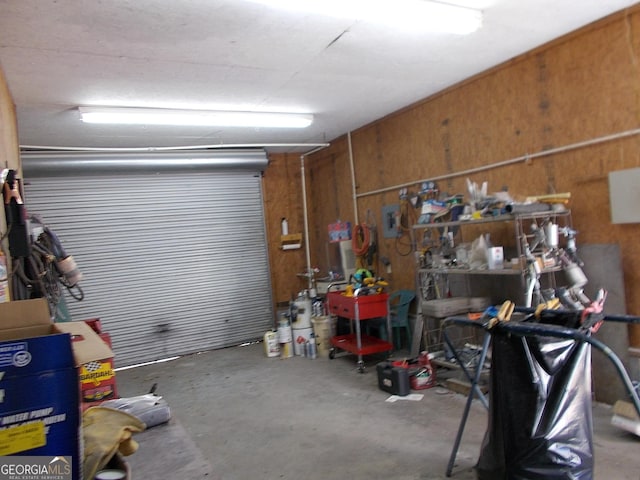 garage featuring wooden walls