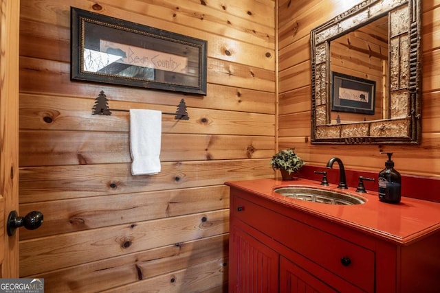 bathroom with wooden walls and vanity