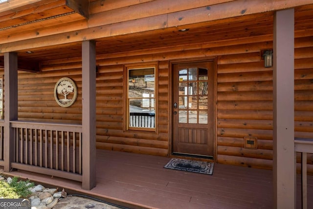 property entrance with log veneer siding