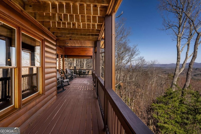 wooden terrace featuring a mountain view