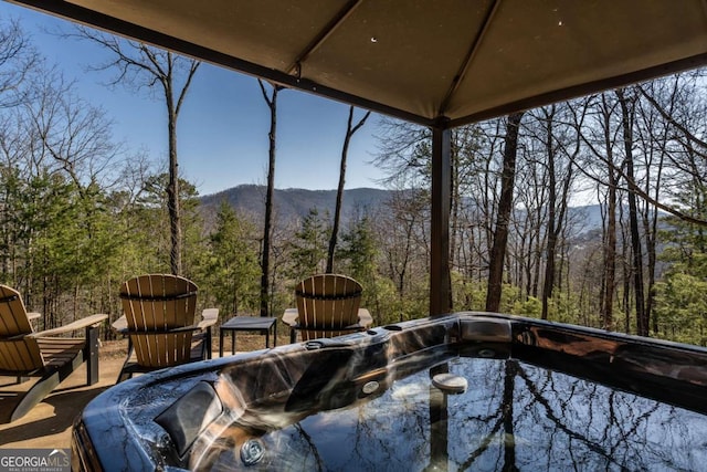 exterior space featuring a view of trees and a mountain view