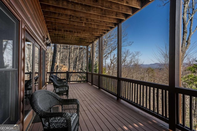 wooden deck featuring a mountain view