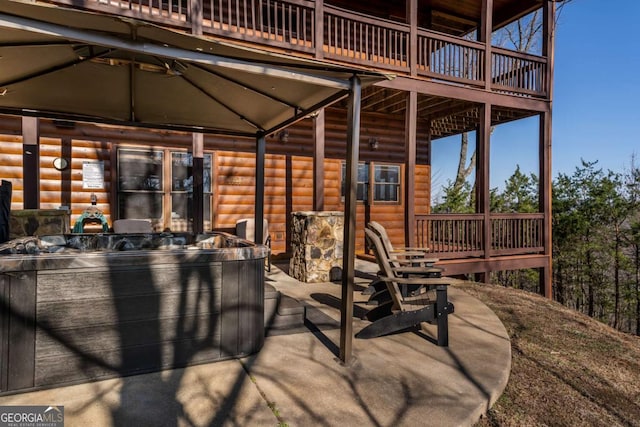 view of patio / terrace featuring a hot tub