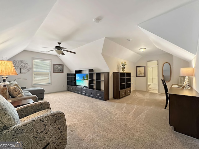 living room with ceiling fan, lofted ceiling, and light carpet