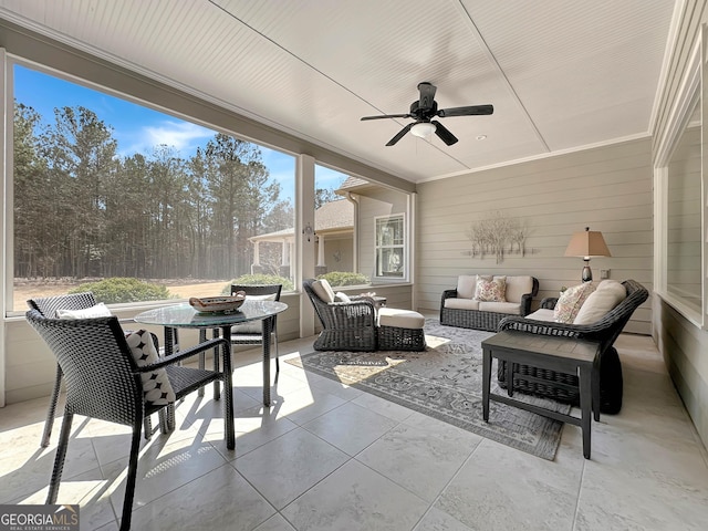 sunroom / solarium with ceiling fan