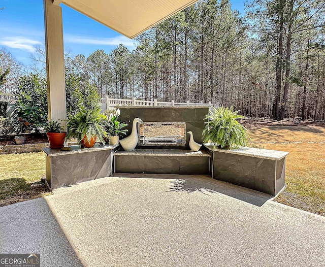 view of patio featuring fence