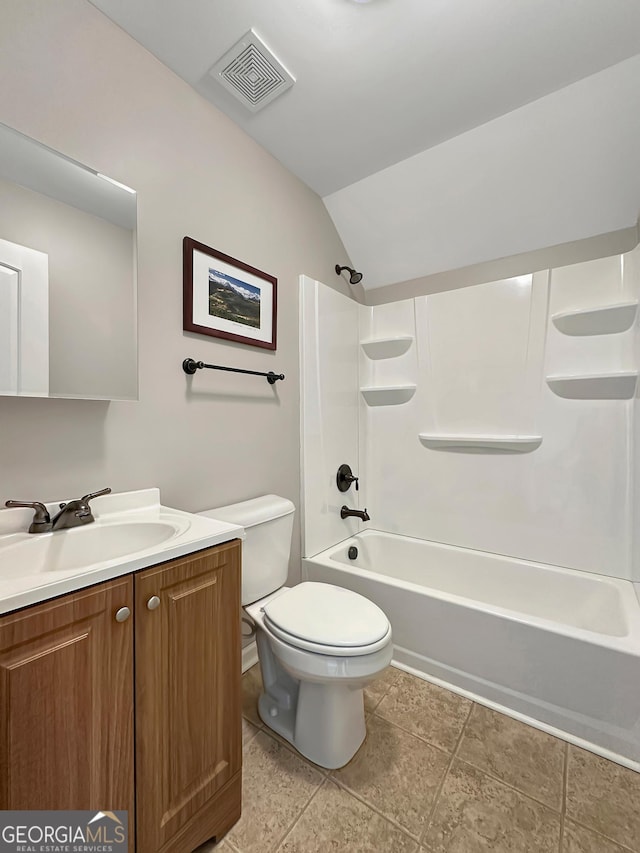 full bathroom featuring visible vents, toilet, tub / shower combination, lofted ceiling, and vanity