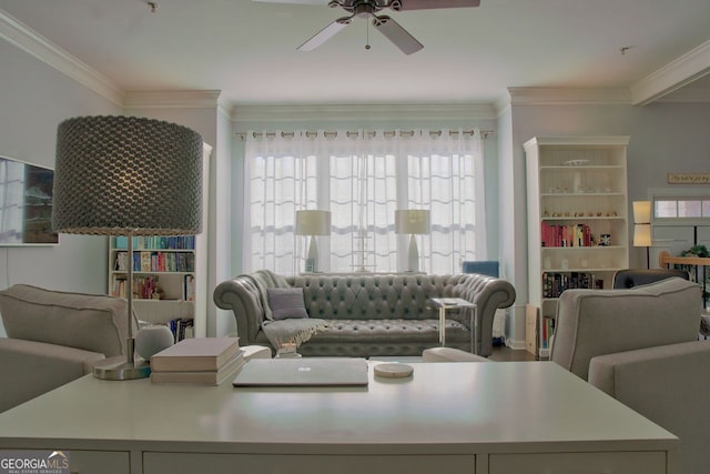 living area featuring a ceiling fan and crown molding