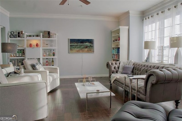 living area featuring baseboards, wood finished floors, ceiling fan, and ornamental molding